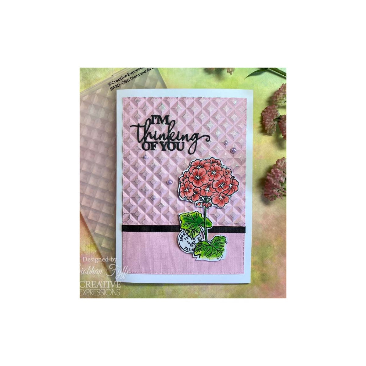 Card with floral design and 'I'm thinking of you' text on a textured background