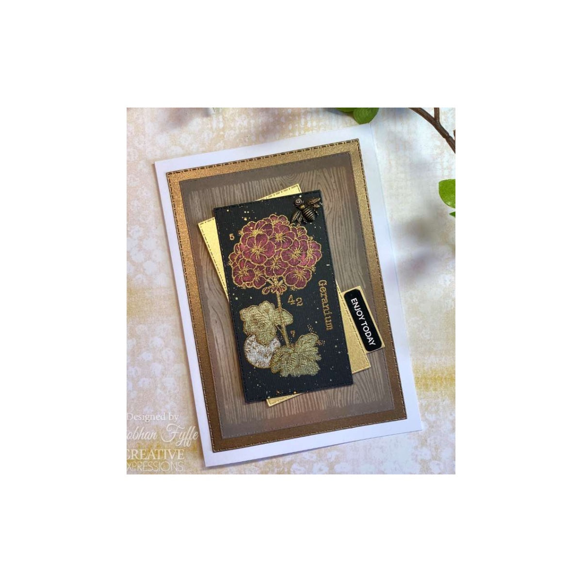 Sample greeting card with geranium design and gold accents